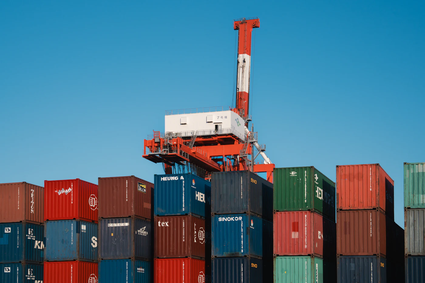 Shipping containers and cranes at a logistics port