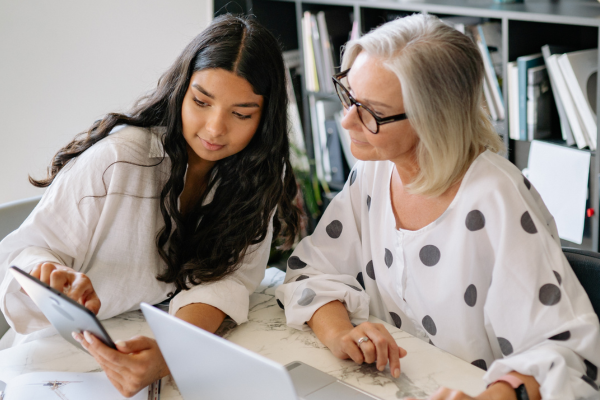Business owner trying to delegate task to her employee.