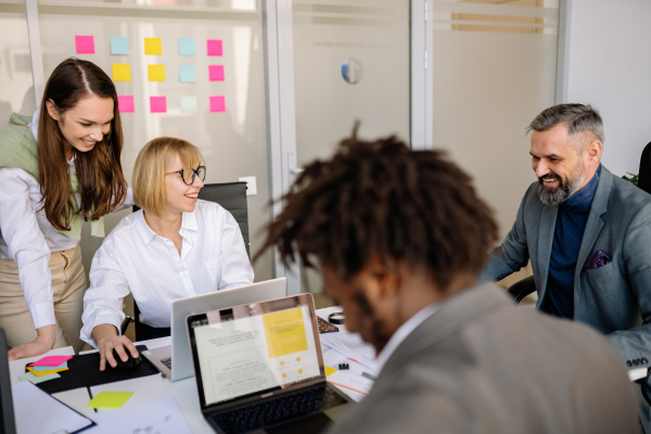 Business owner leading a structured meeting with notes or agenda. Business owner leading a structured meeting with notes or agenda.