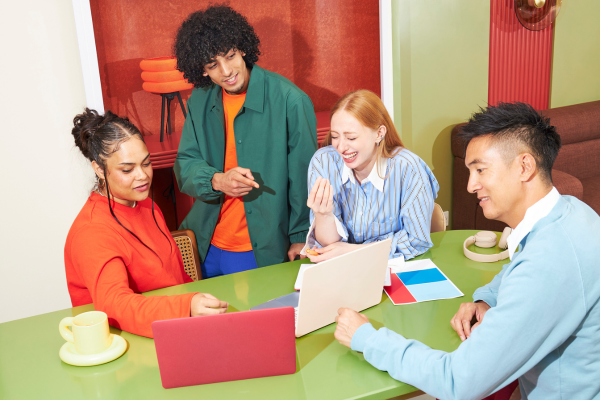 A small business team having a relaxed meeting around a table
