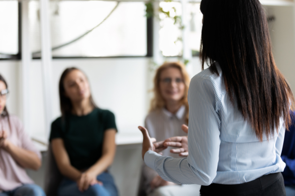 A business owner coaching a staff members