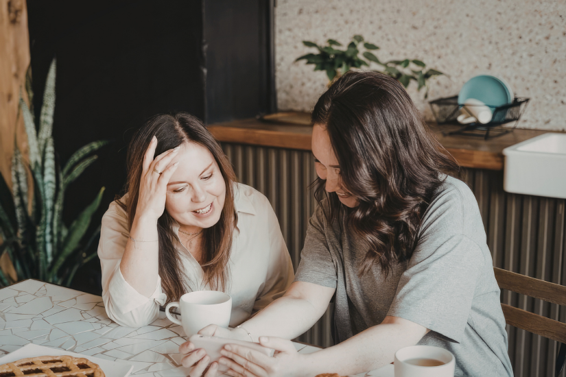 Two people having a relaxed business conversation over coffee