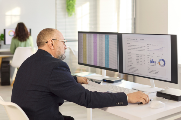 A confident business owner reviewing business performance metrics.