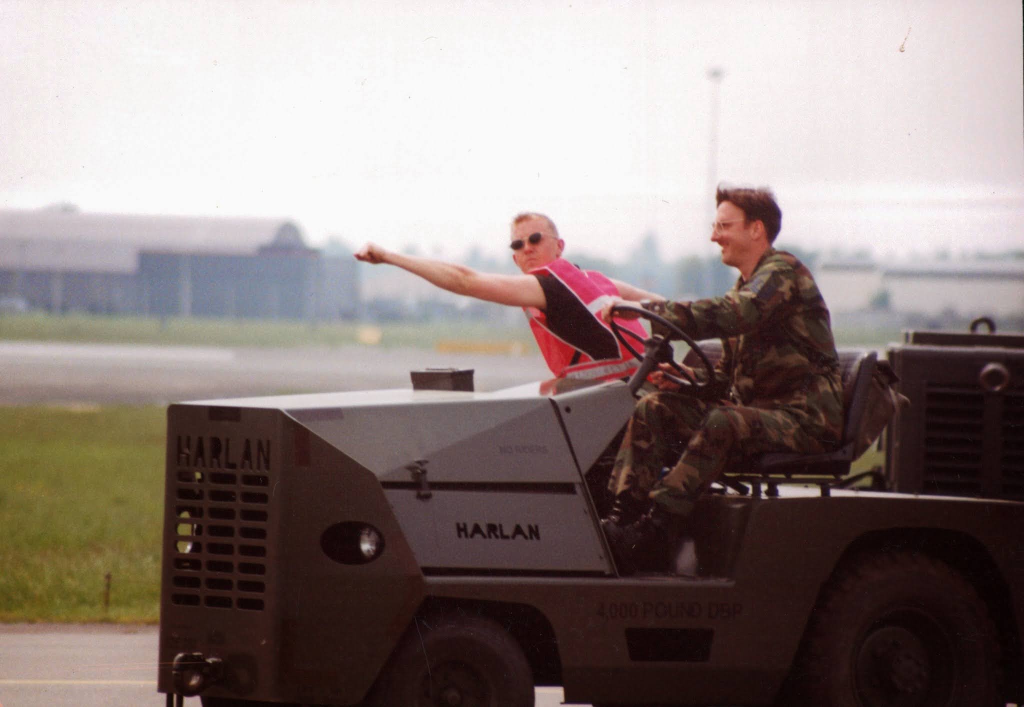 Jonathan on the flightline driving a Harlan tow tractor, U.S. Air Force
