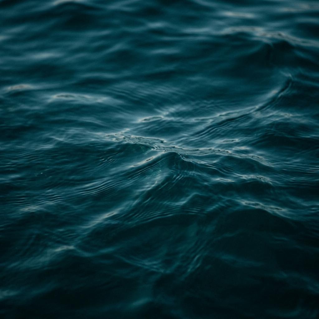 Soft light moving across the ocean surface