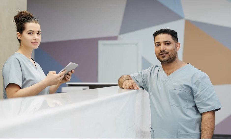 Clinic staff at the reception desk of a dental office