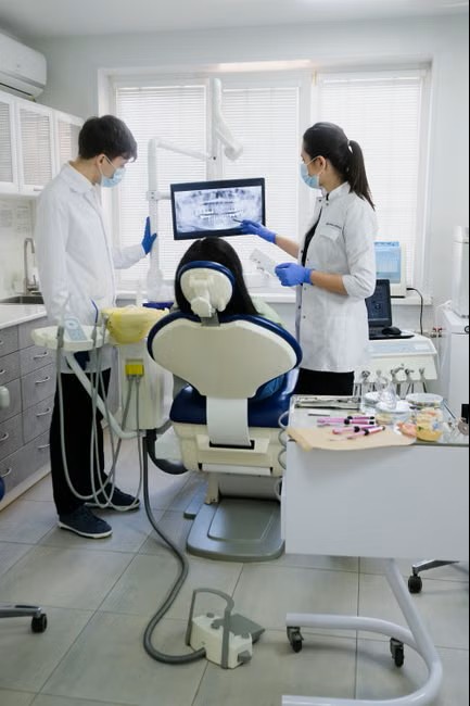 Dental team reviewing an image together in the operatory