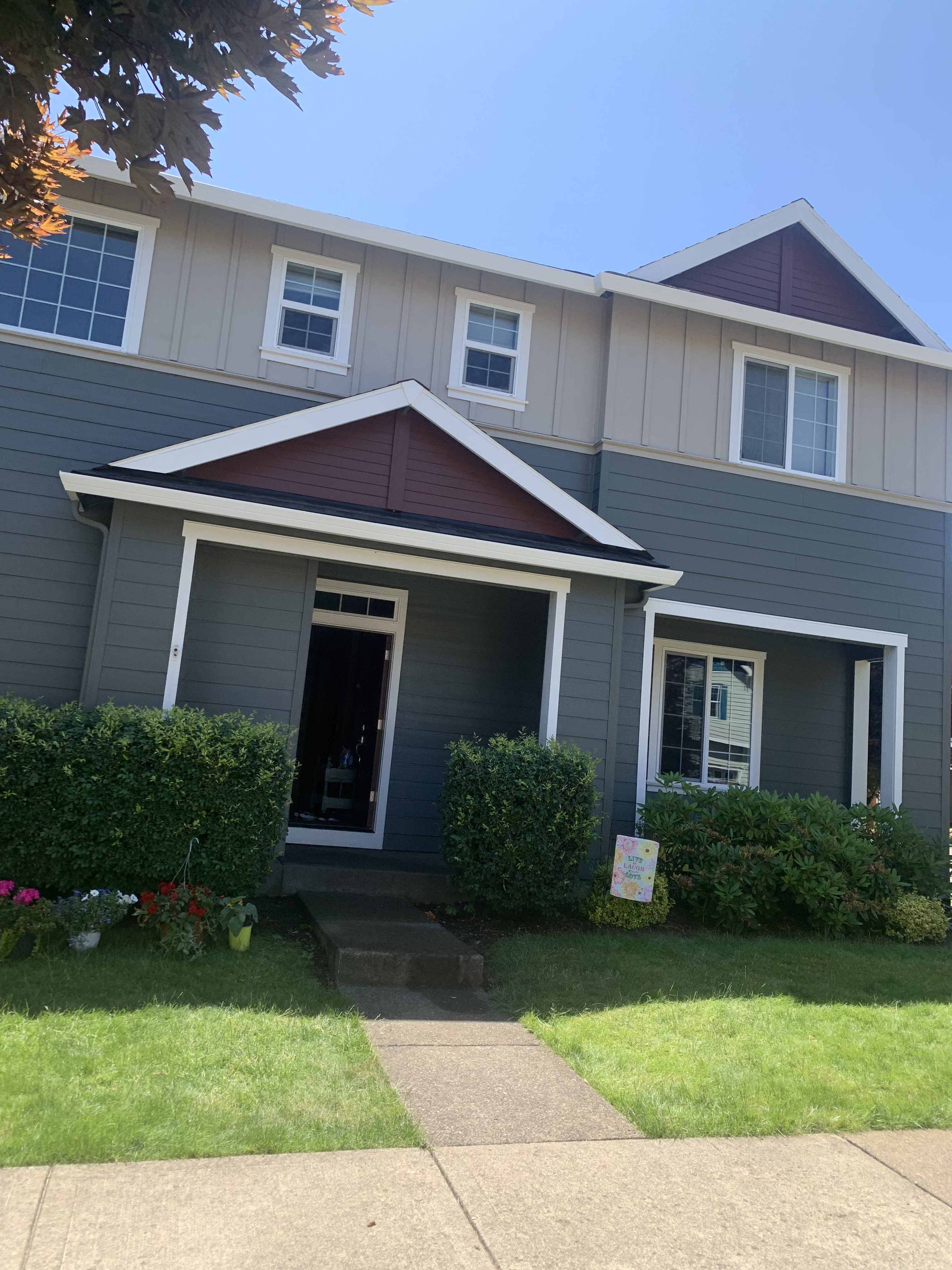 SR Professional Painters team applying a flawless exterior paint finish to a residential home in Forest Grove, OR