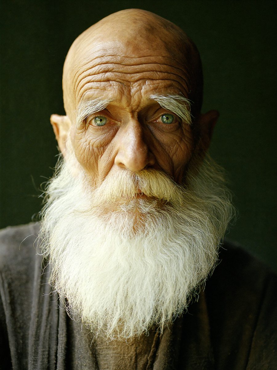 The Watchman, an elderly man with a long white beard and sea-green eyes