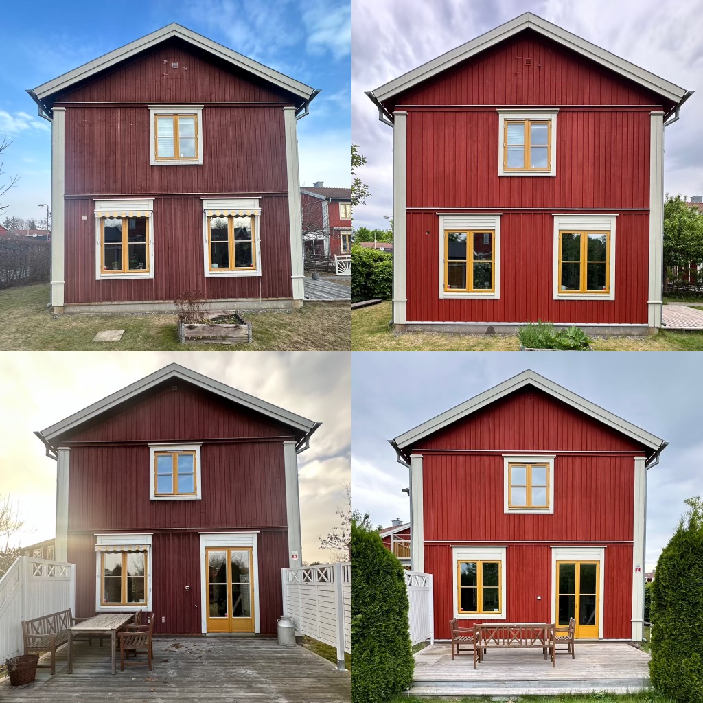 Stort rött hus som precis fått en fasadmålning. 