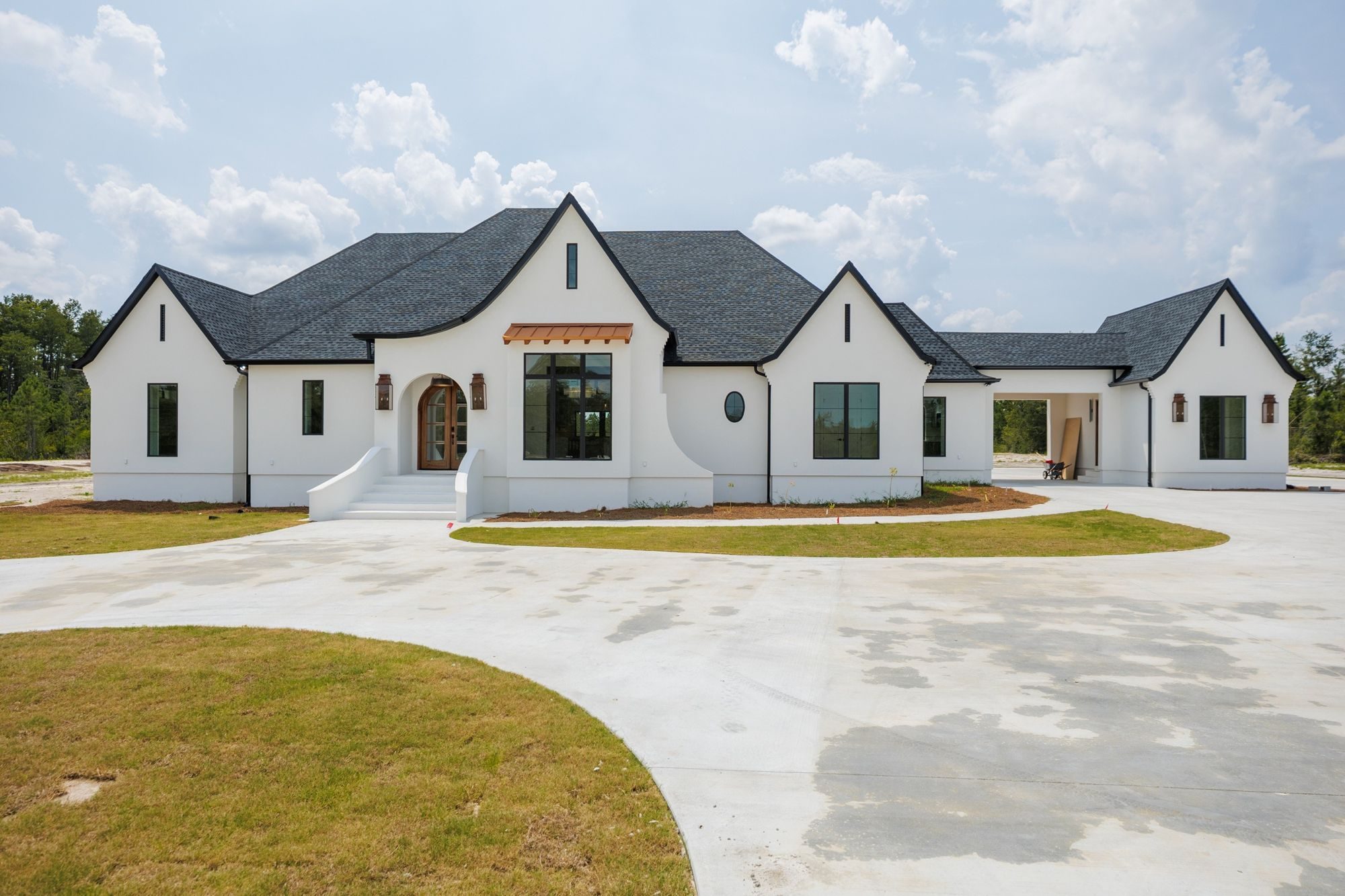 Front elevation of a white LaCatalina custom home