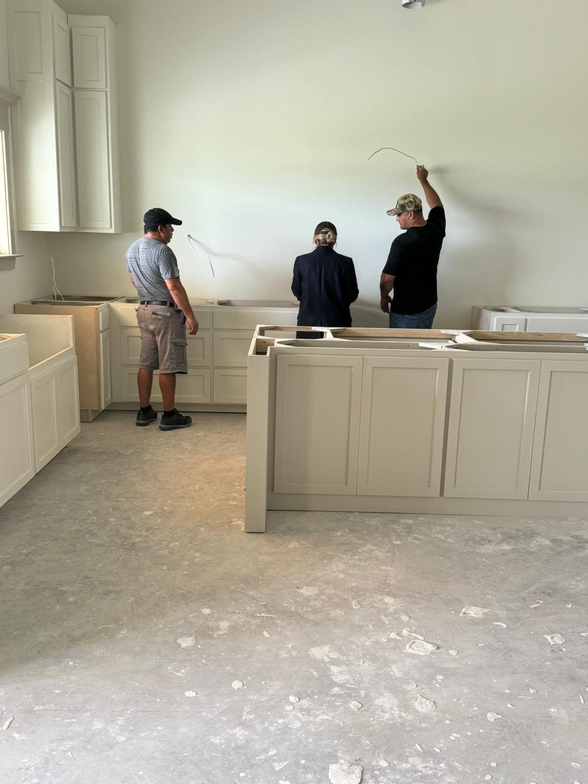 Lincy Hurtado and Jorge Patchett walking a kitchen layout on site