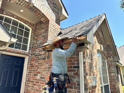 Professional Roofer Working on Exterior Repair