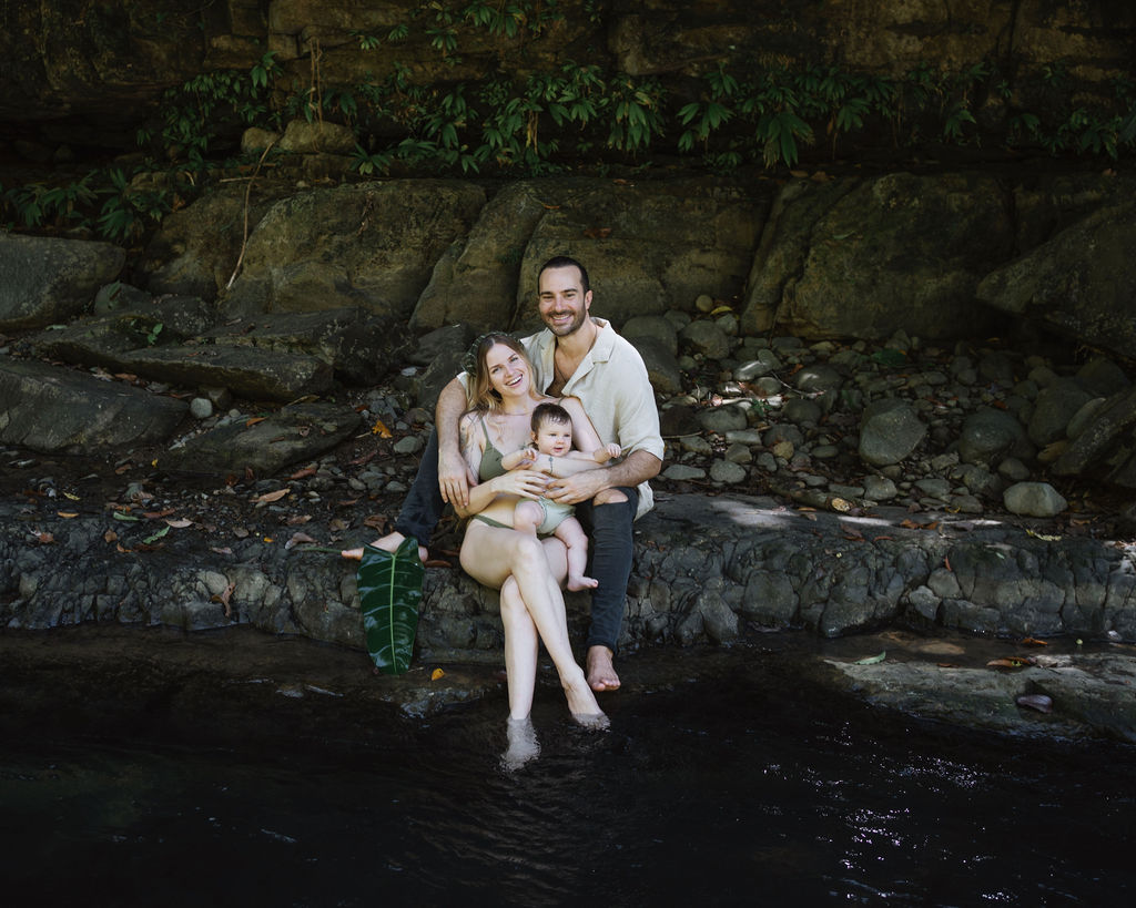 Luke with his family by the river