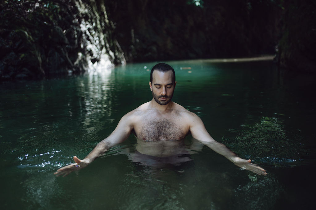Luke seated in water in contemplative masculine initiation