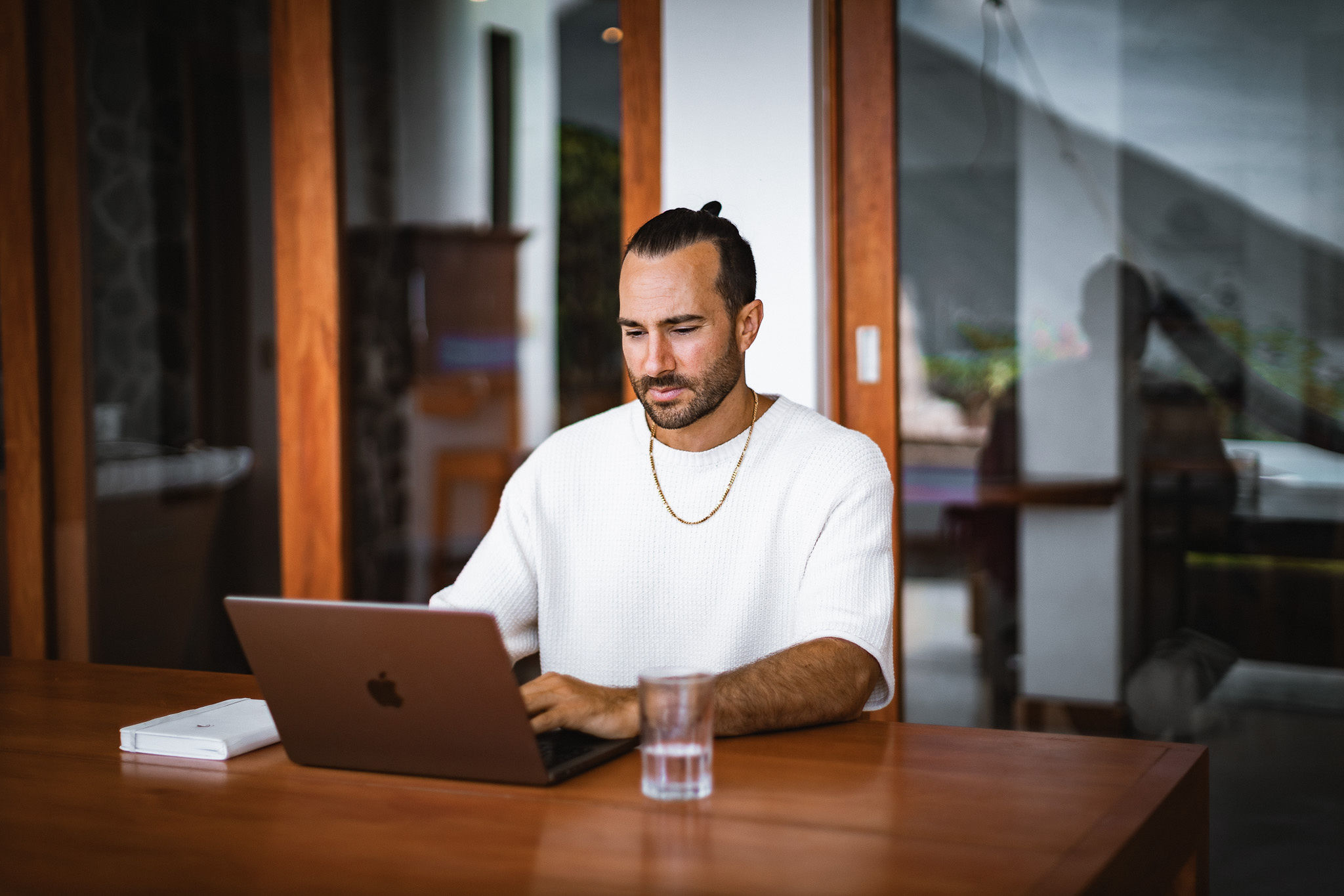 Luke working at a laptop