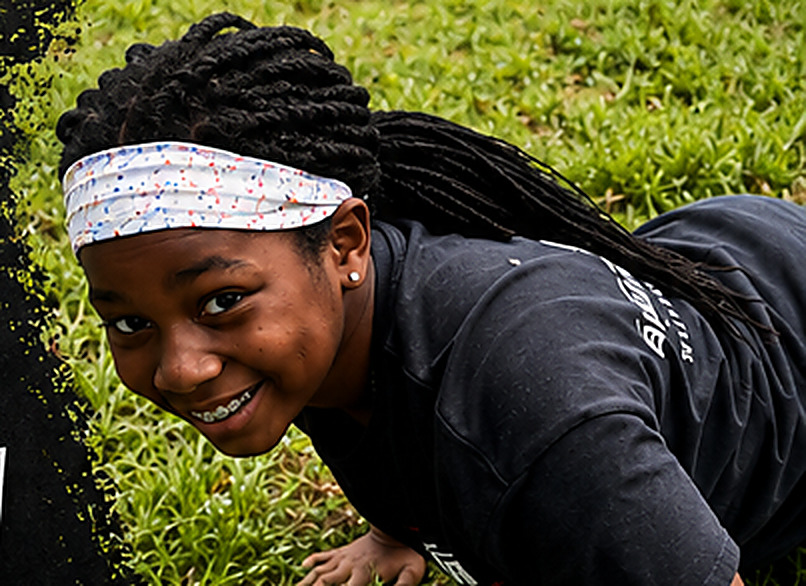 A Systema Floyd student training on the grass