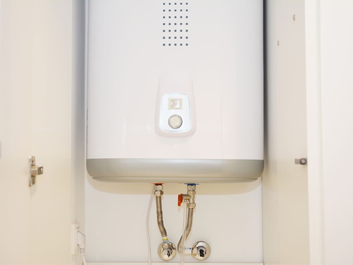 Compact modern boiler installed in a utility closet, showcasing efficient heating for Selden homes.