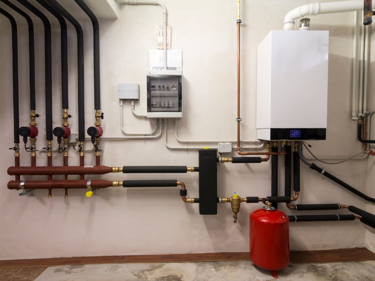 Advanced boiler system installed in a utility room, featuring multiple pipes and components for optimized heating in Selden.