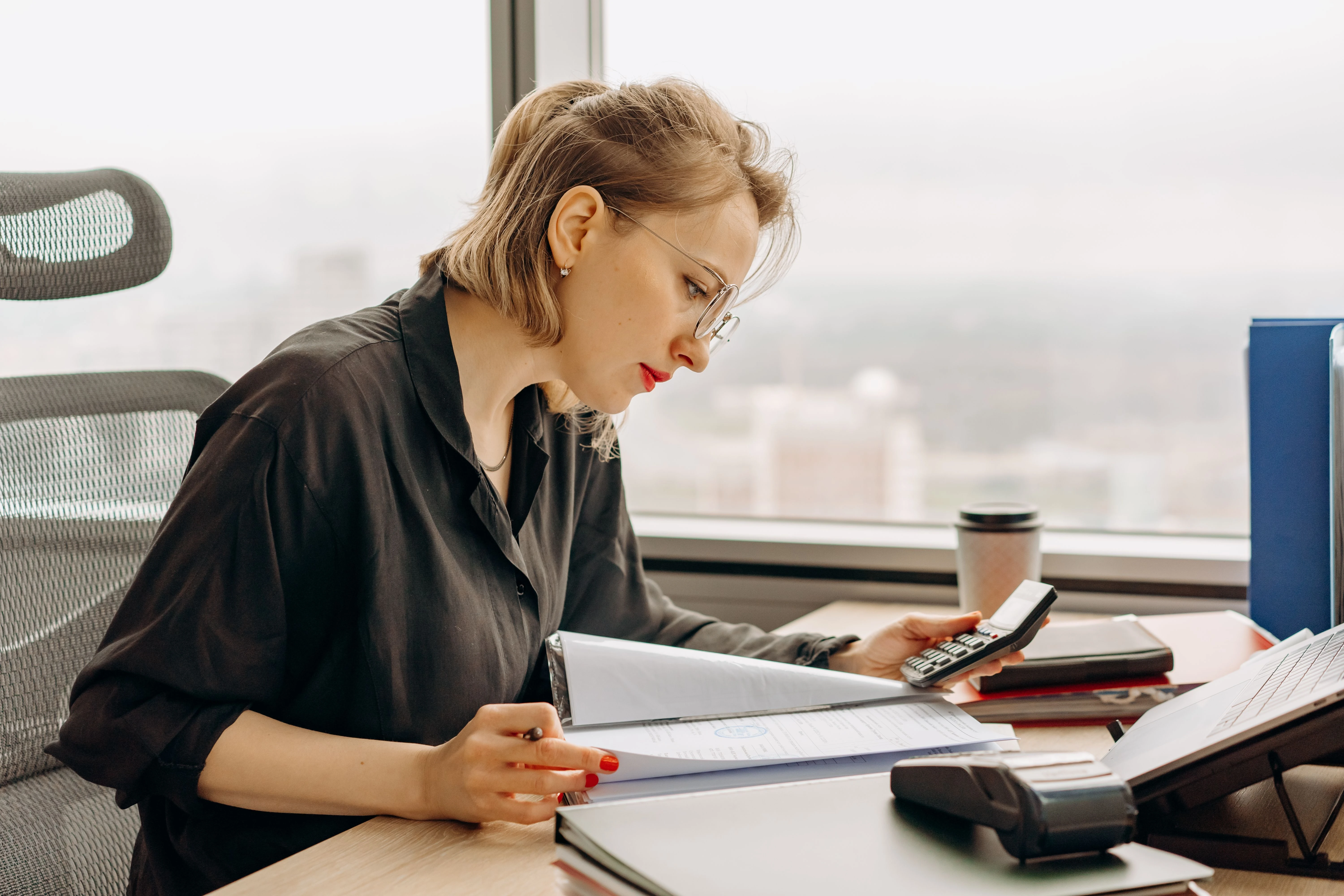 Professional bookkeeper reviewing financial statements for a Florida small business