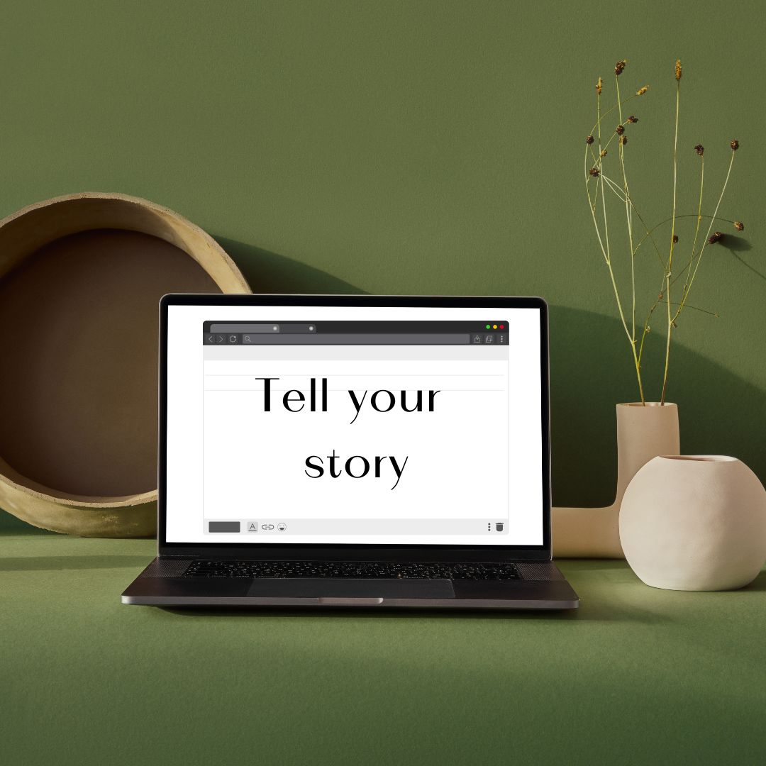 Laptop with the text "tell your story"