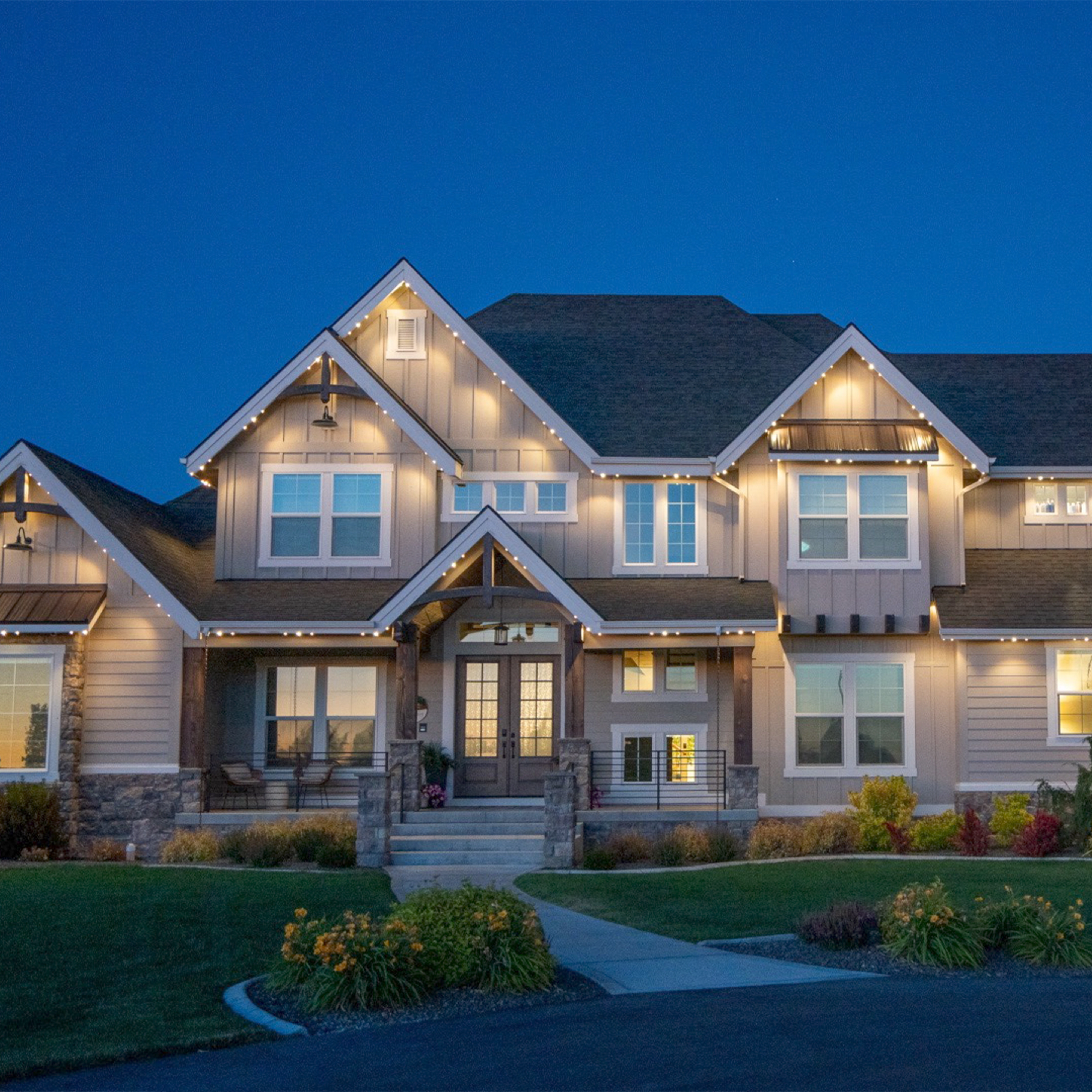 Home with warm white permanent architectural roofline lighting