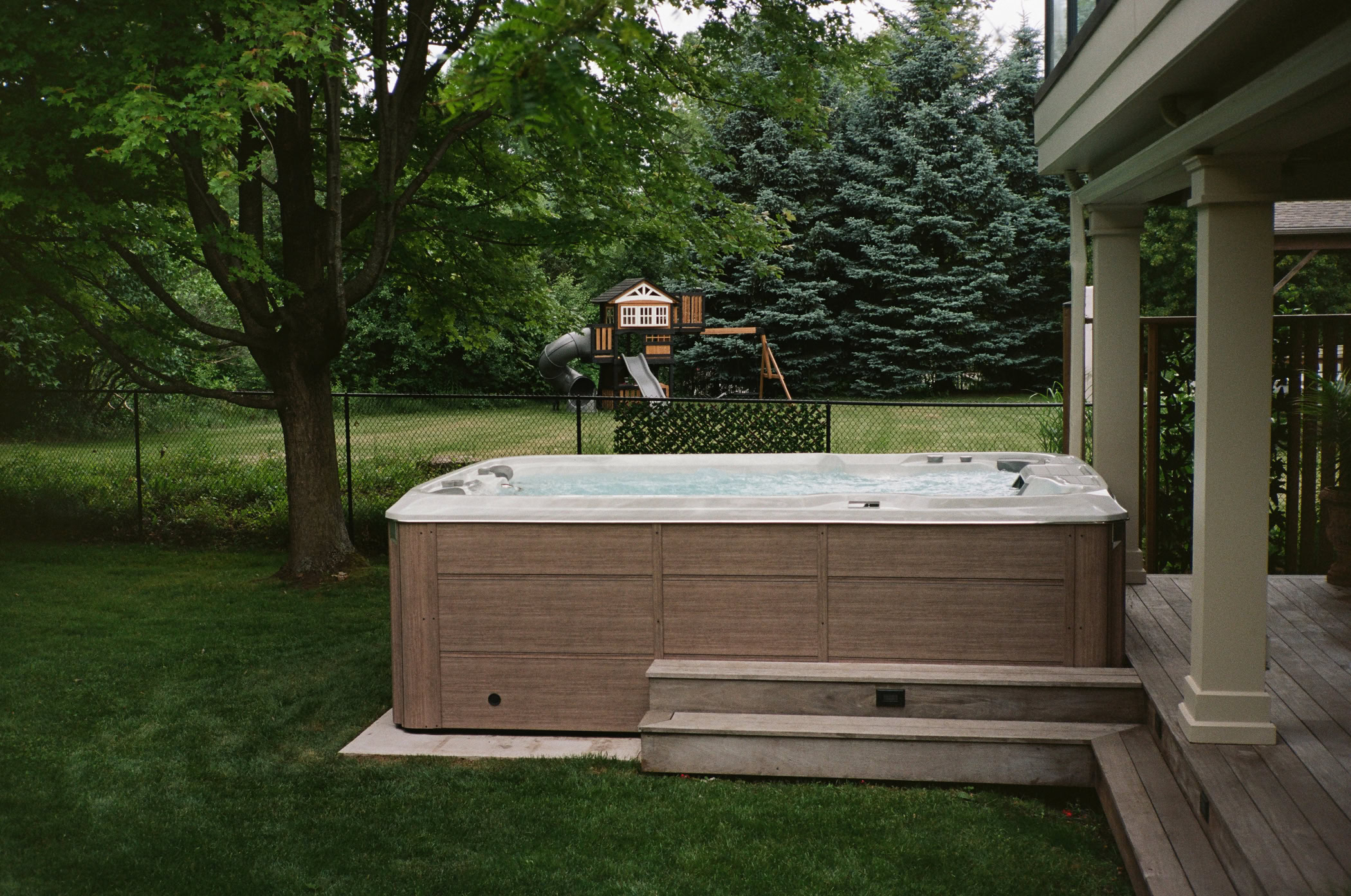 Sundance® Swim Spa in backyard