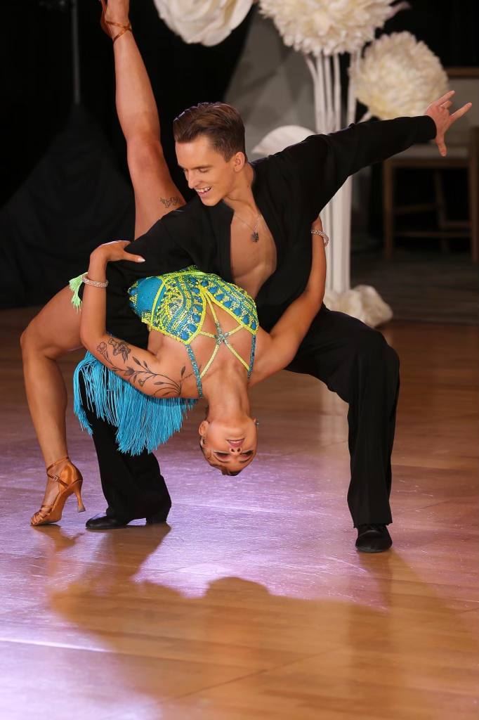 Dmytro Roshchupkin dancing rumba at a ballroom competition