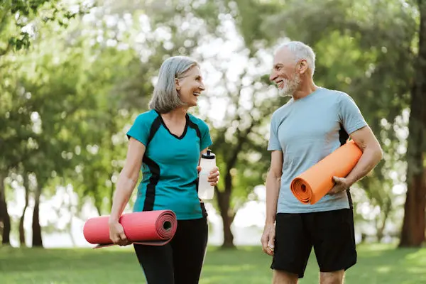 An active older couple walking outdoors