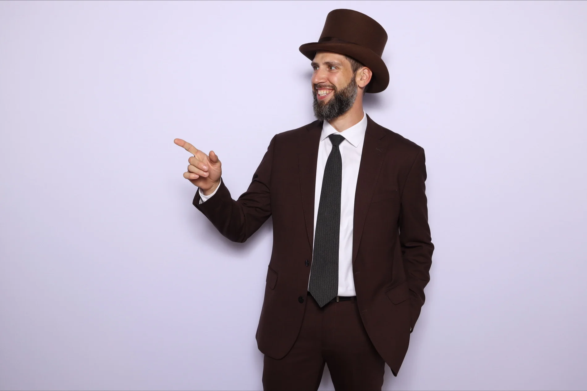 Miles Harding wearing his signature top hat, founder of Wondering Concierge and embedded strategic marketing partner for boutique hospitality and wellness brands