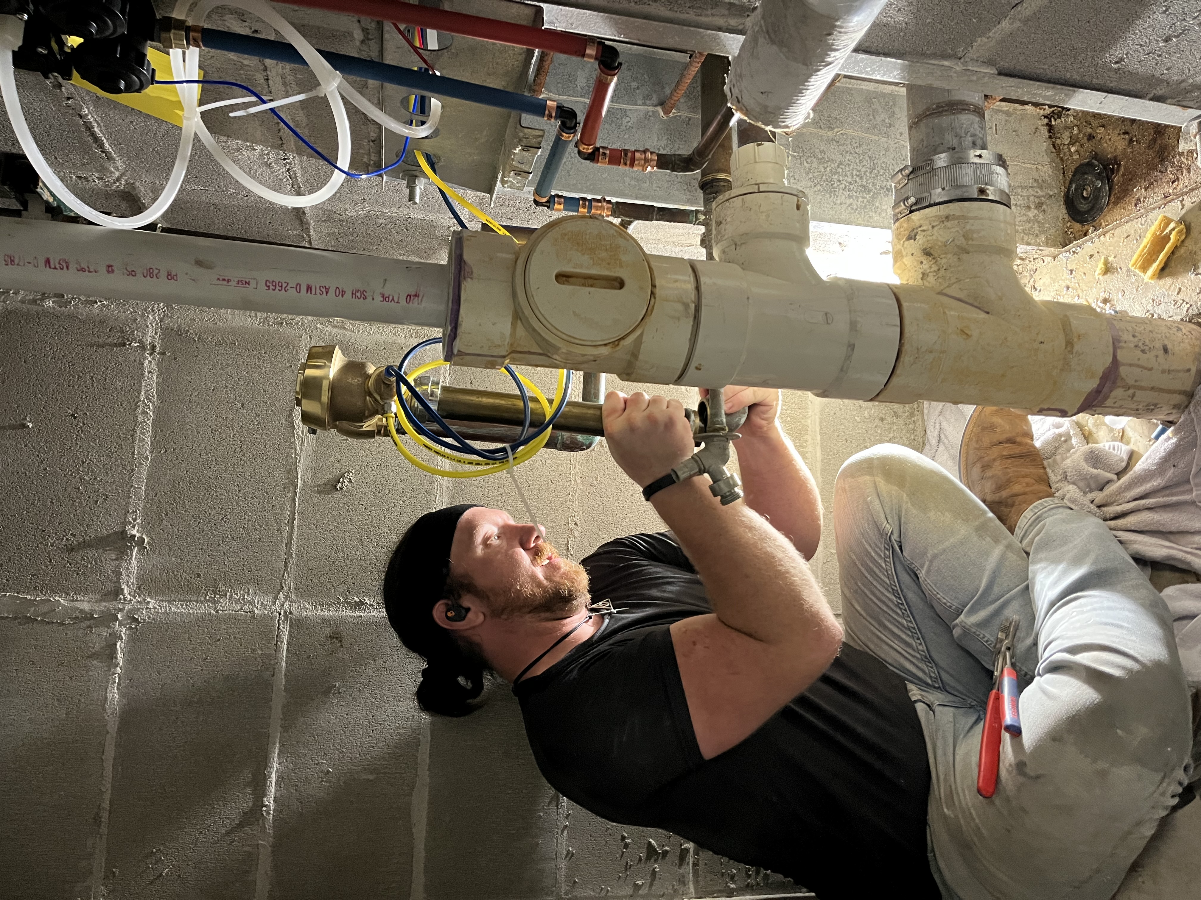Plumber working on water line project in Mobile Alabama, showcasing completed plumbing work.