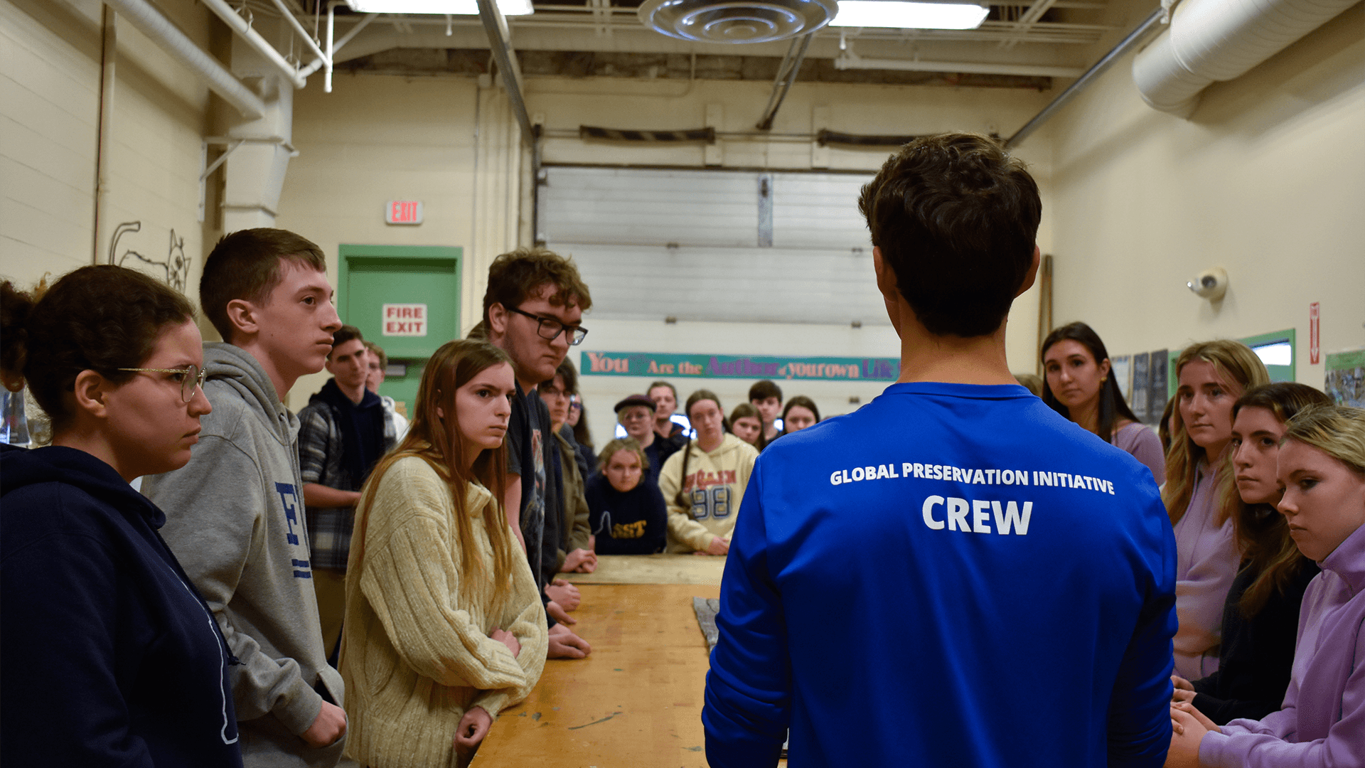 Our education team sand sifting plastic with a group of students