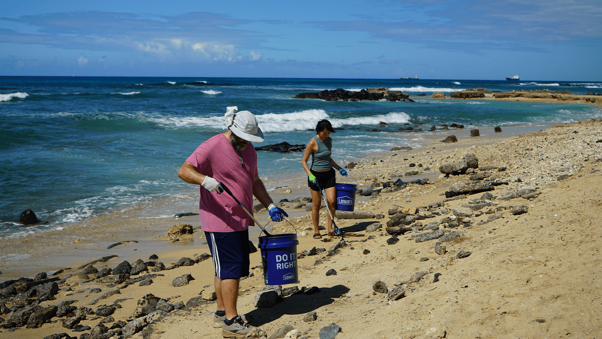 Community volunteers cleaning trash from a stream