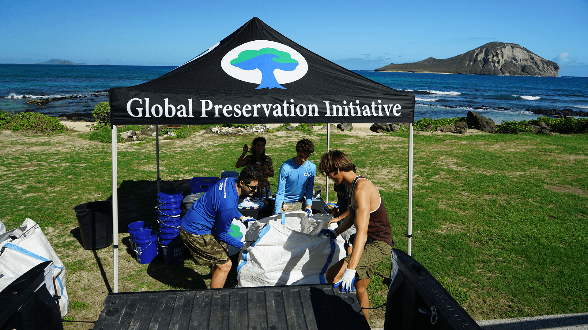 Our education team sand sifting plastic with a student on Oahu, Hawaii