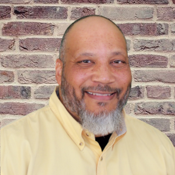 Image of the Ultimate Lead Generation Mastery Club Founder Joe Sayles, Jr. in front of a brick background.