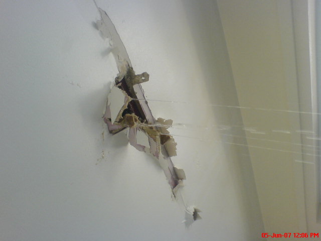Water tracking through a roof onto the ceiling below.