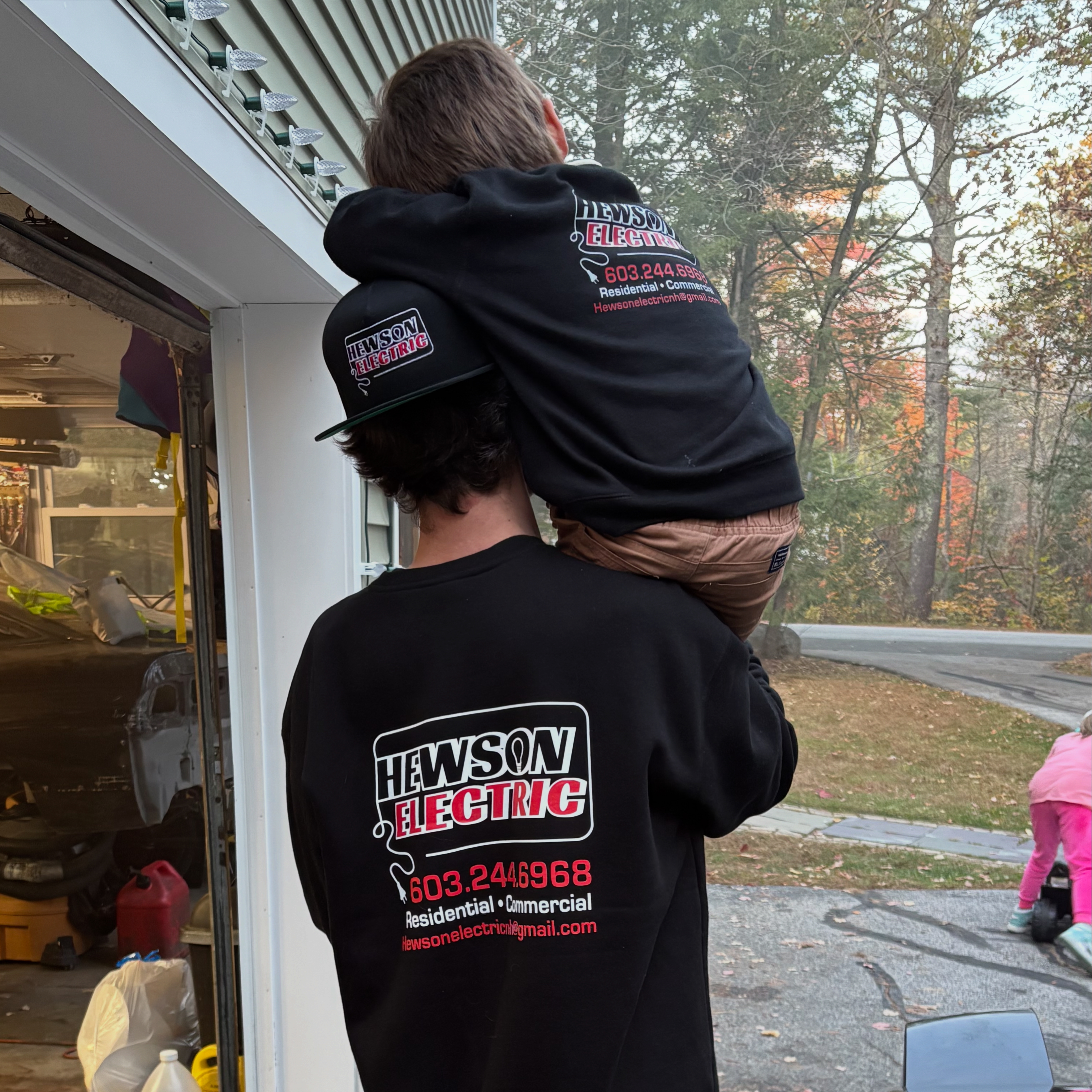Rich Hewson, owner of Hewson Electric, with his son in Auburn NH — local residential electrician serving Manchester, Auburn & southern New Hampshire