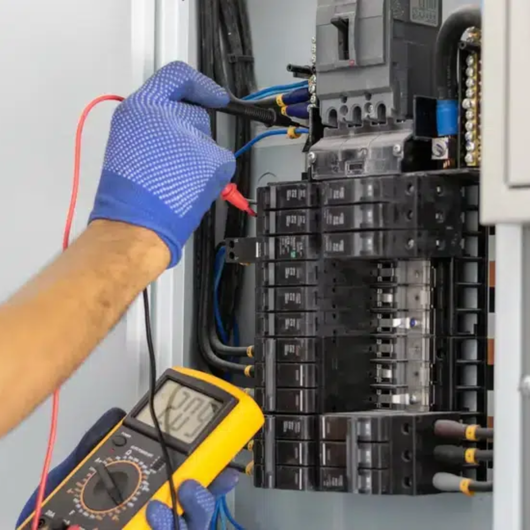 Electrician testing residential electrical panel