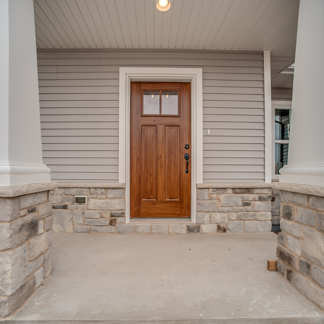 Residential home exterior with porch lighting — new construction electrical and home wiring services by Hewson Electric in southern NH