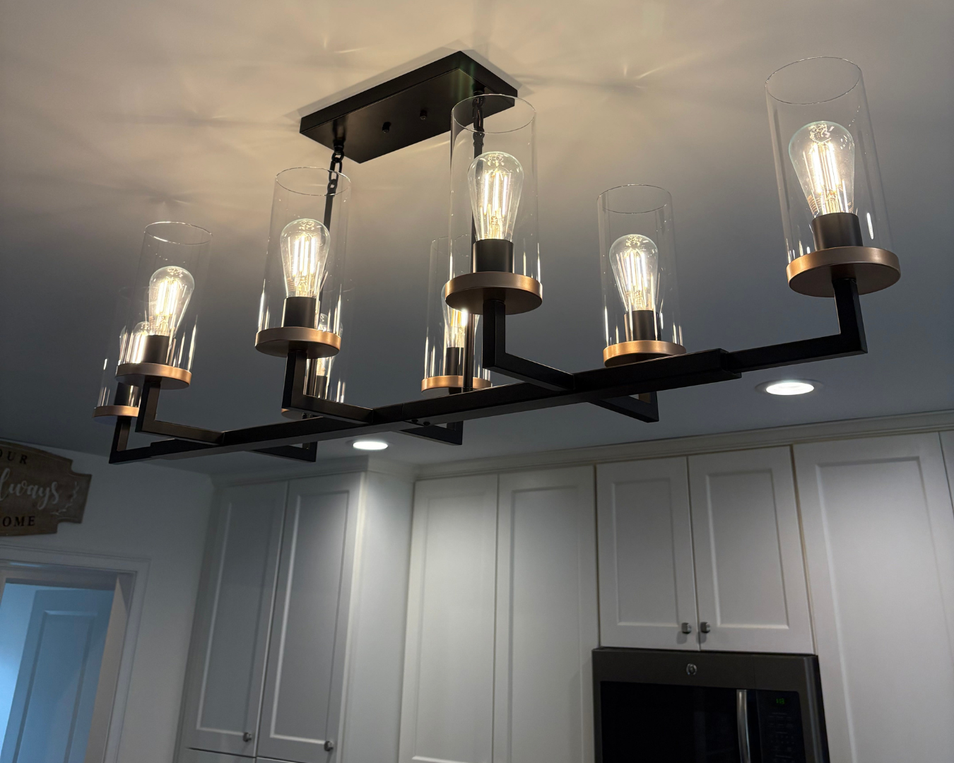 Custom kitchen chandelier installation by Hewson Electric — residential lighting design and installation in southern NH