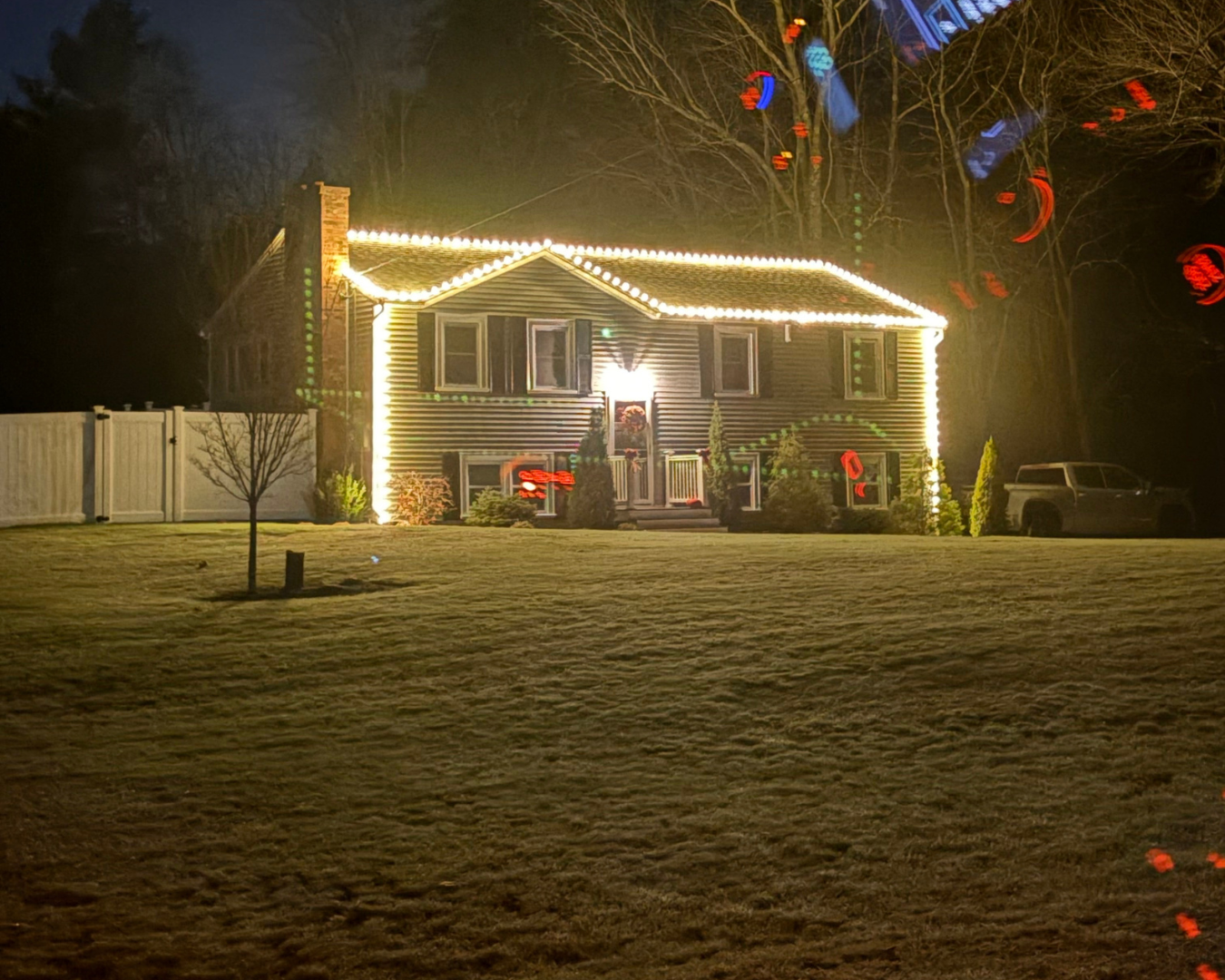 Professional custom Christmas lighting installation on a residential home in southern NH by Hewson Electric