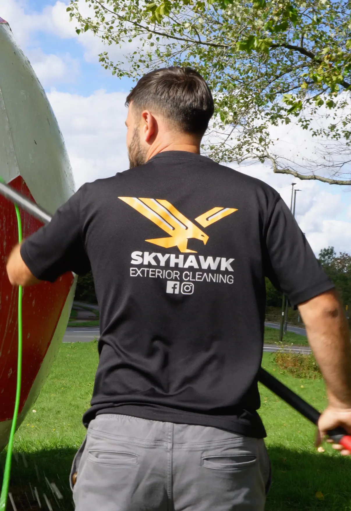 Skyhawk cleaning the giant football landmark outside Crawley Town FC