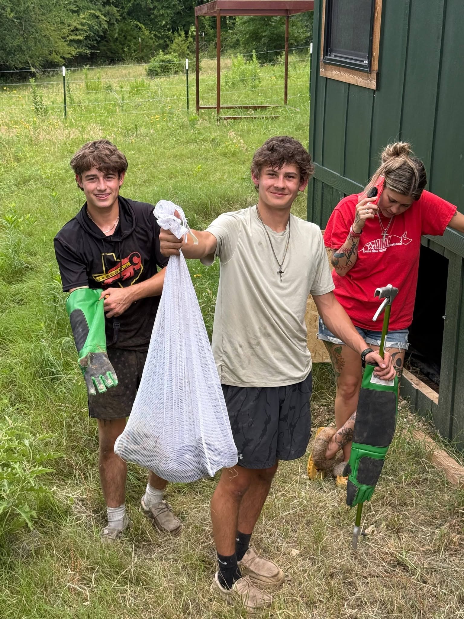 Lone Star Wildlife Solutions technician with captured snake after successful removal from residential property