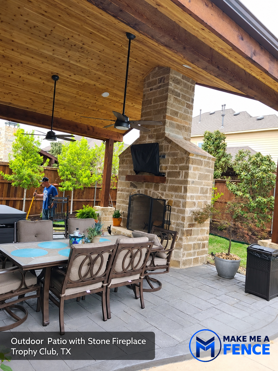 Outdoor patio with stone fireplace installed by Make Me A Fence in Trophy Club, TX