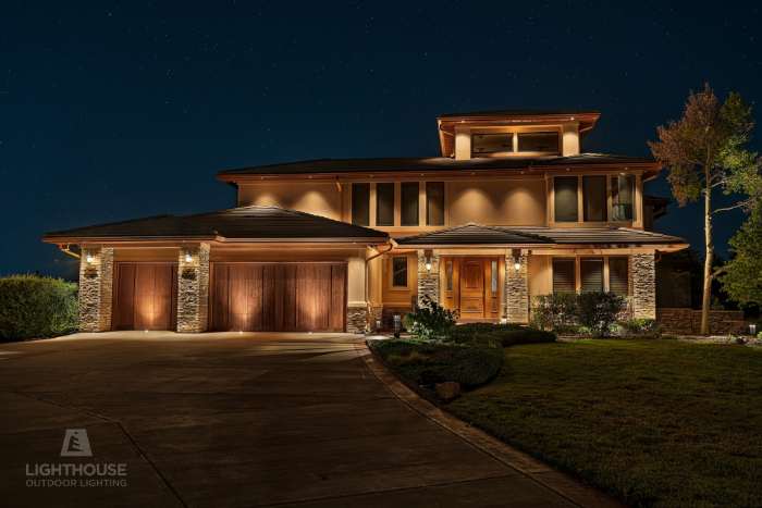 Architectural lighting on a stone home facade
