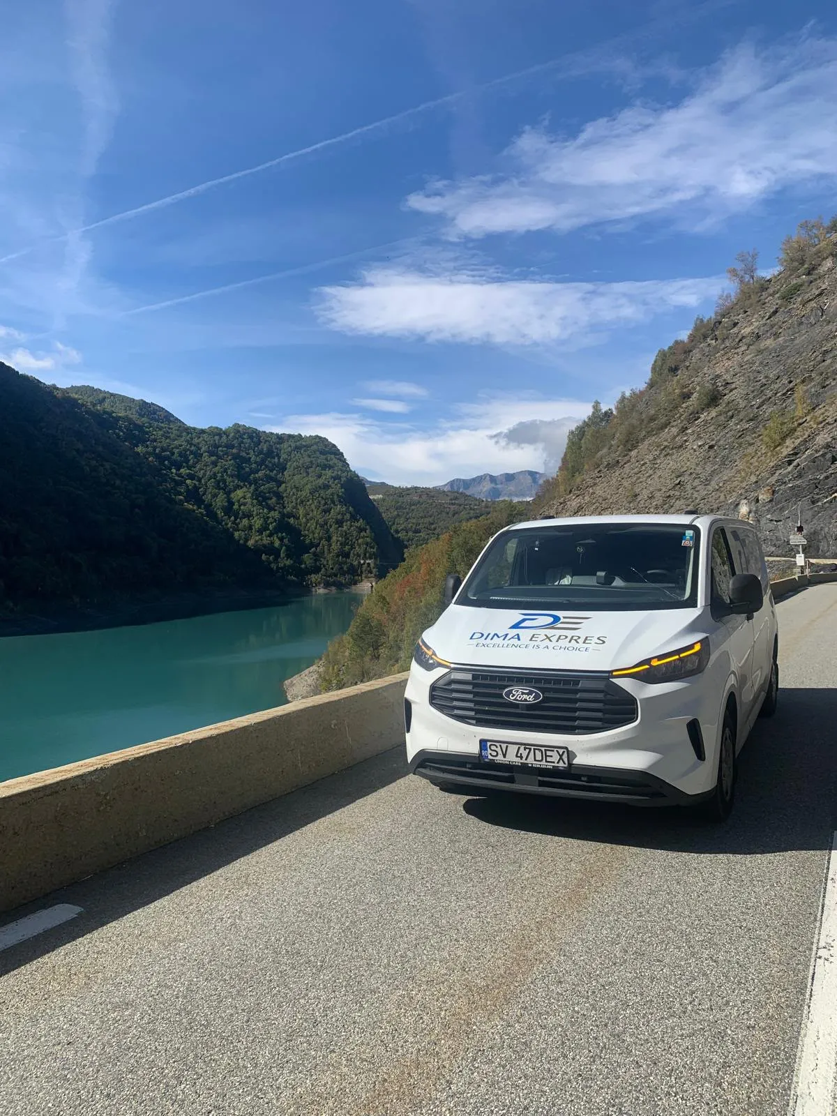 Dima Expres van on a lakeside road