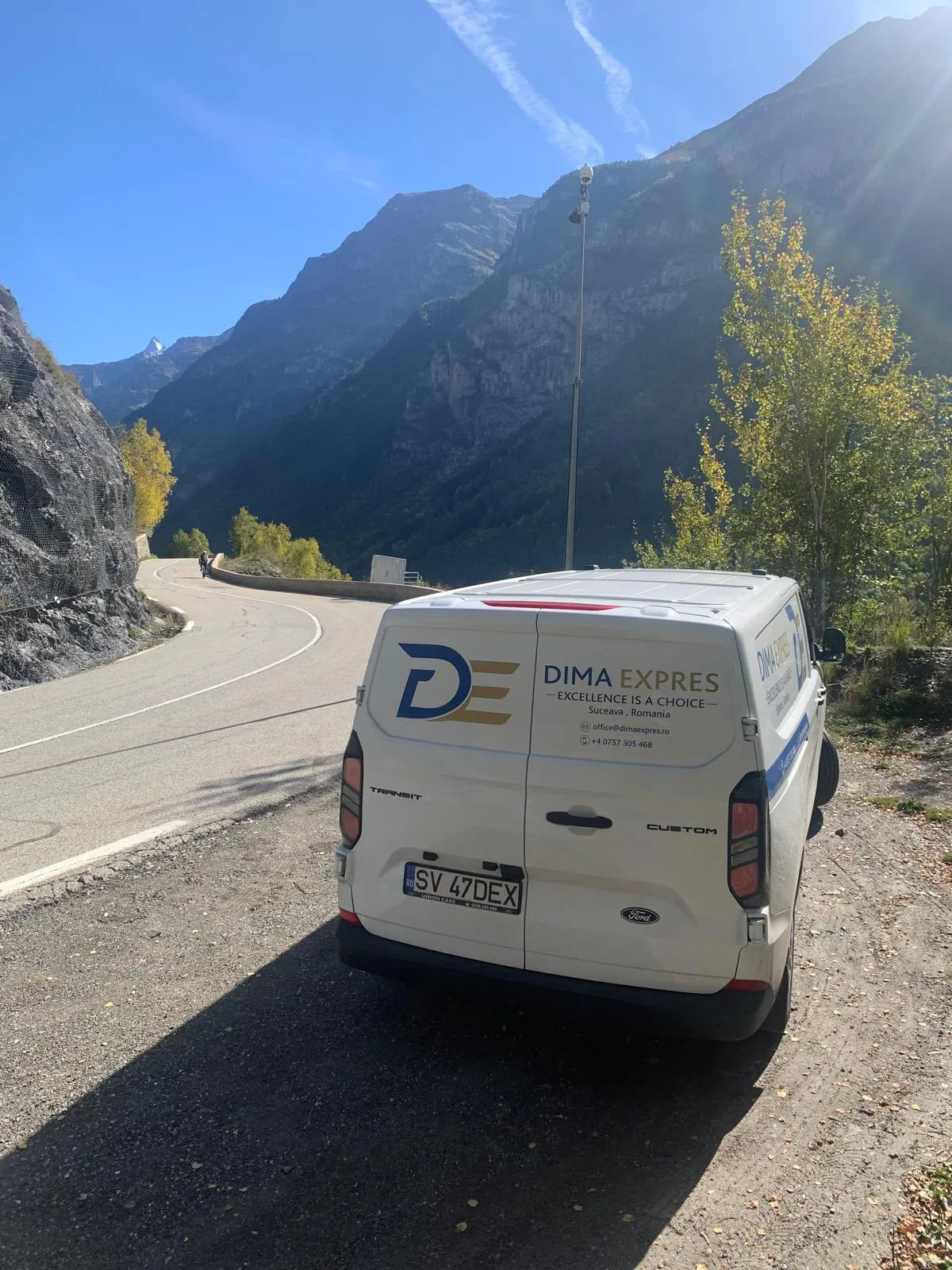 Dima Expres van on an Alpine road