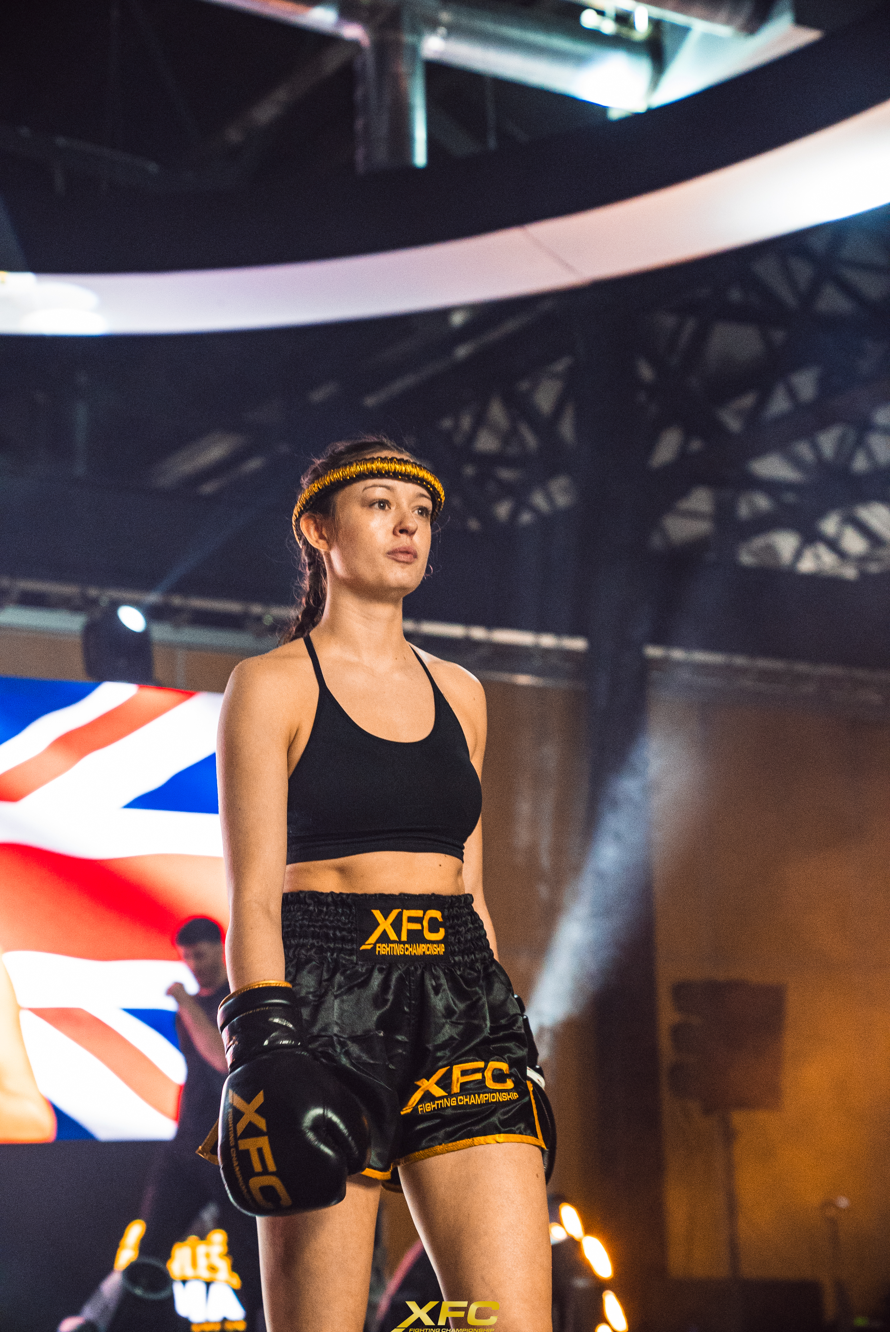 Katie Harvey in fight kit walking out before a bout