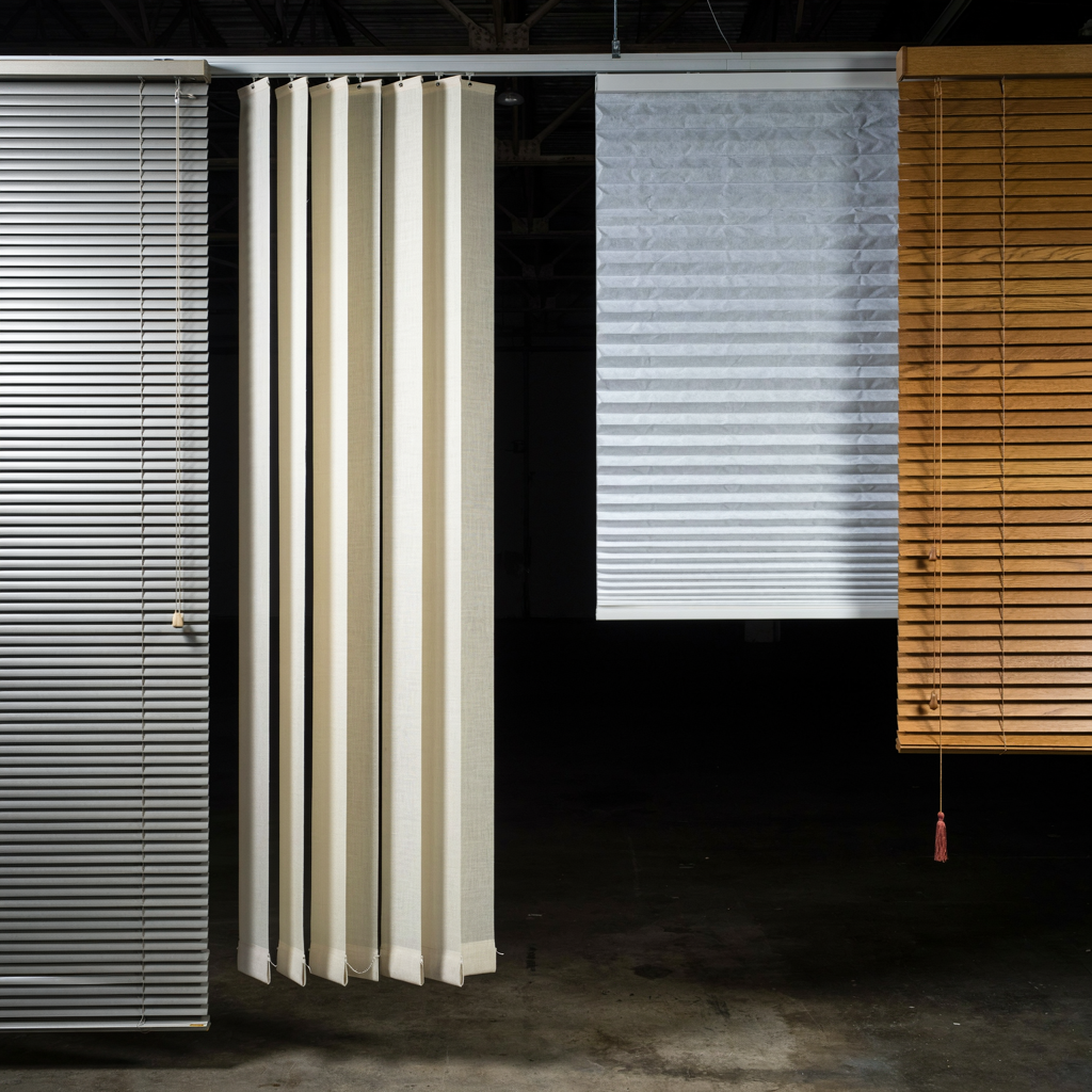 Several different types of window blinds side by side