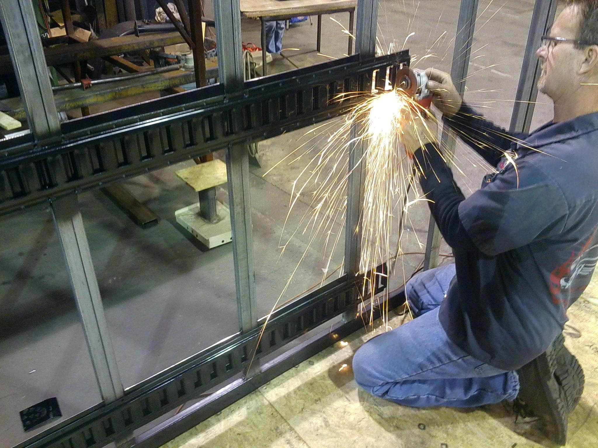 Welding a DirtyBlinds.com mobile cleaning trailer